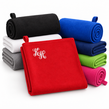 Ielādēt attēlu galerijas skatītājā, Personalized microfiber towels in multiple colors, with a white monogram on the red towel.
